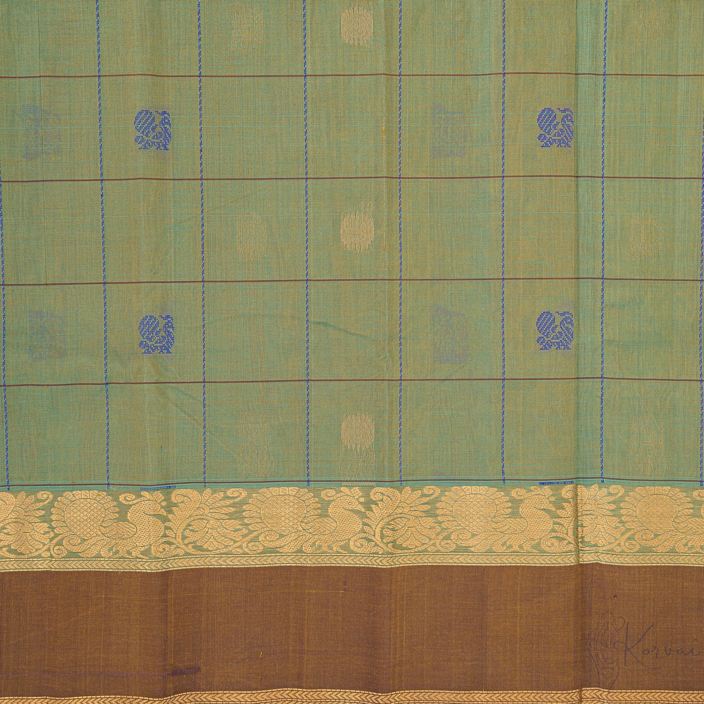 Closer view of green and cream shot coloured body with brown border.