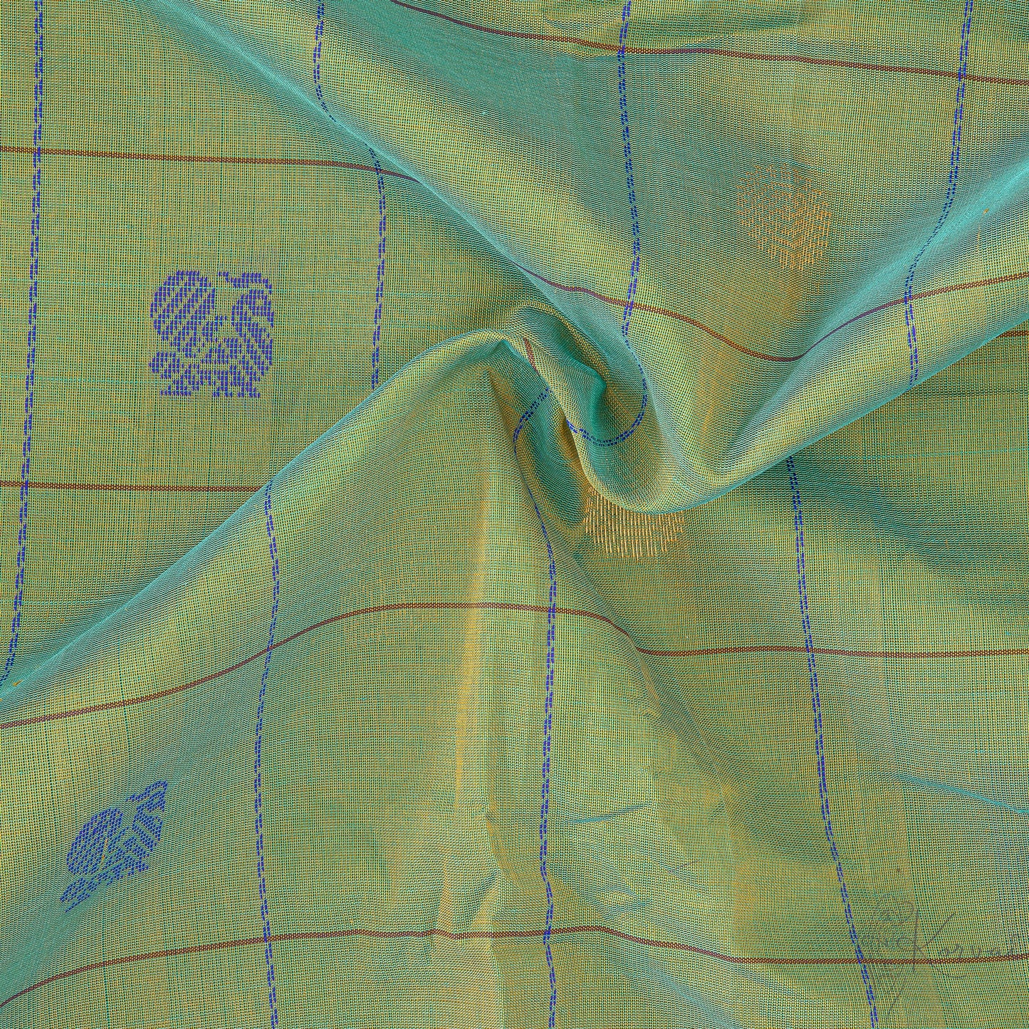 Closer view of green and cream shot coloured body with brown border.