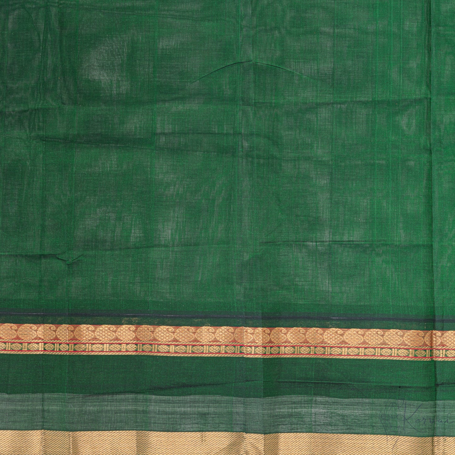 Closer view of bottle green coloured blouse fabric with mango motifsin border.