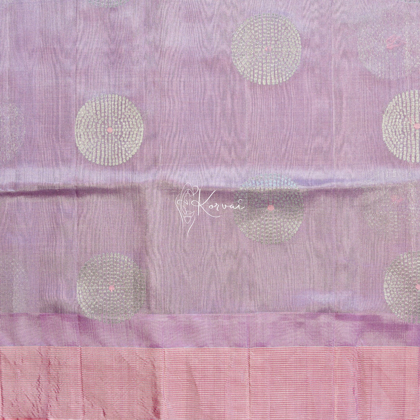 Closer view of the body with dotted circle motifs.