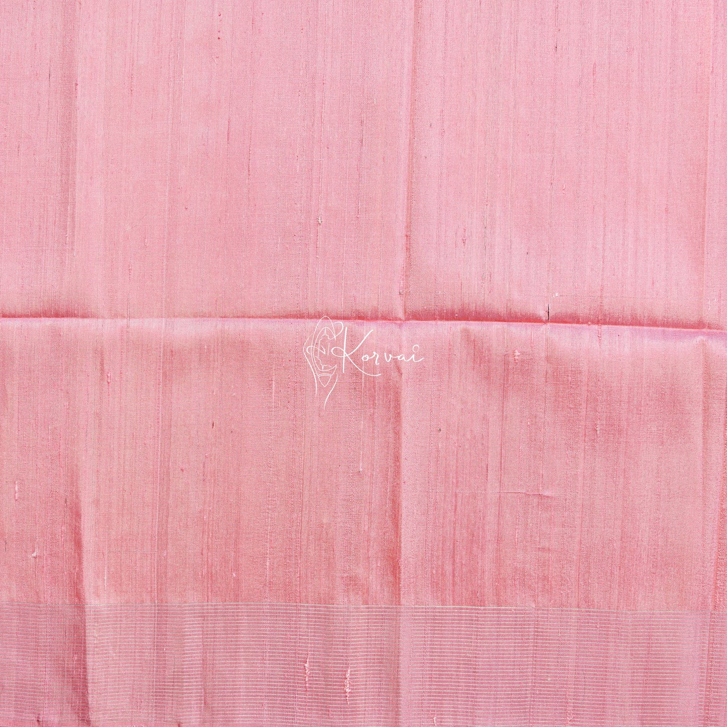 Closer view of blouse fabric that is same colour as the border of the saree.