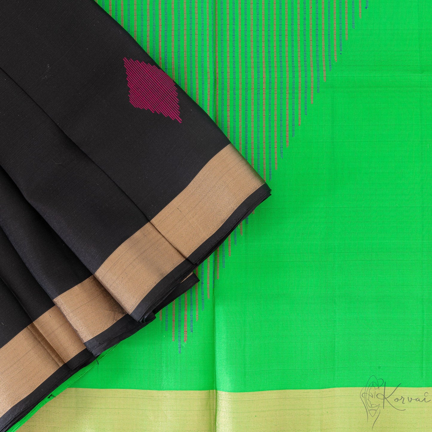 Top view of black soft silk saree with a closer view on parrot green pallu with multi colour diamond motif.
