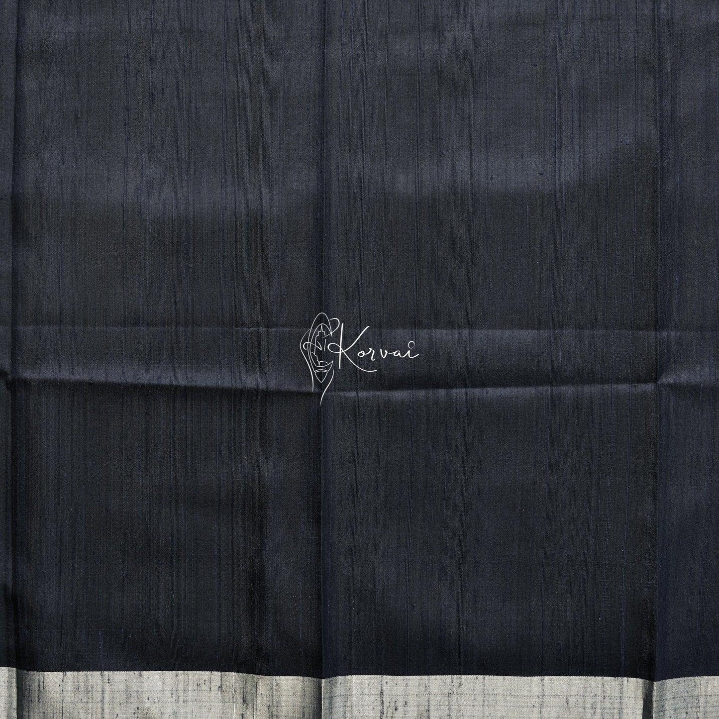 Closer view of blouse fabric that is plain with gold border.