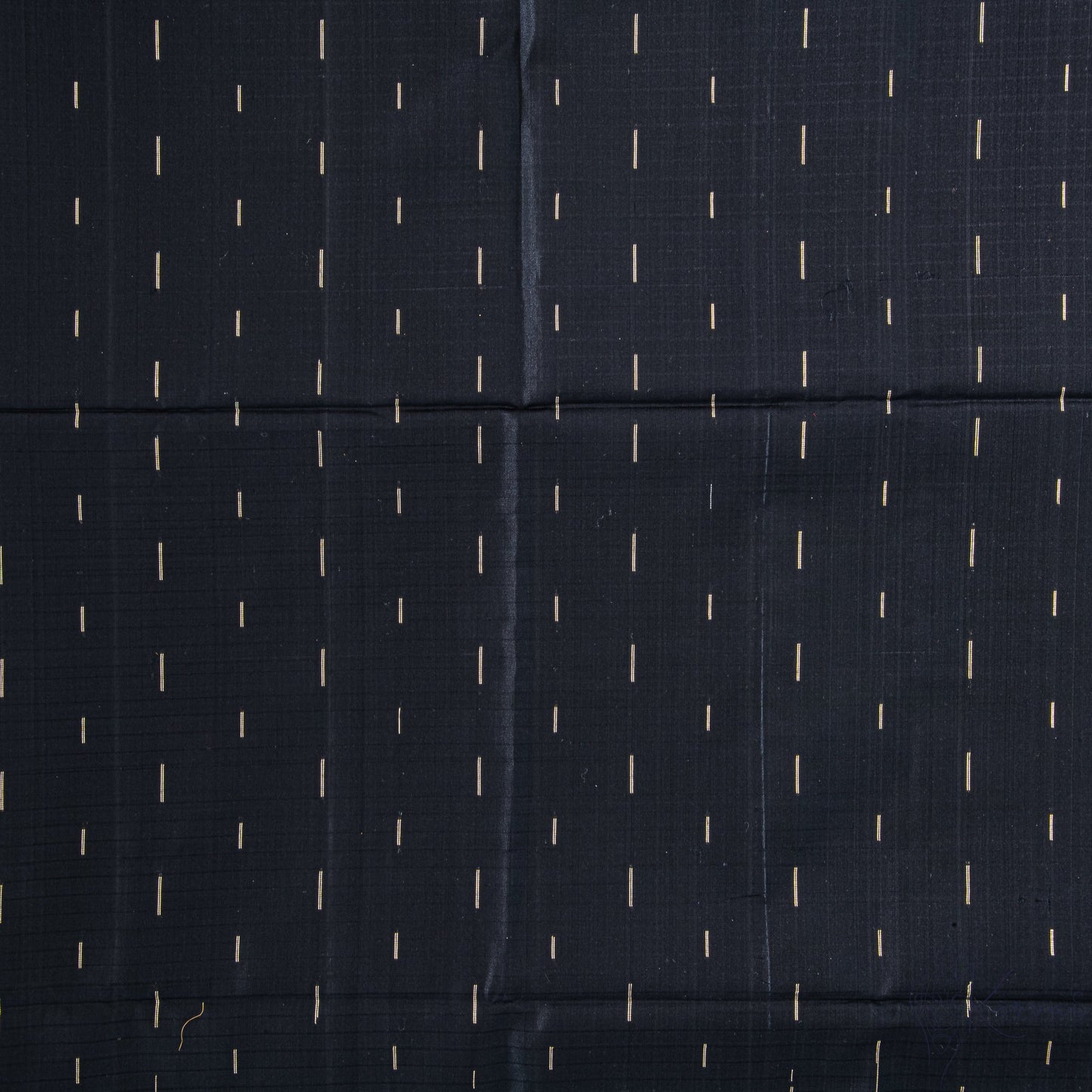 Closer view of black body with gold raindrop zari motif.