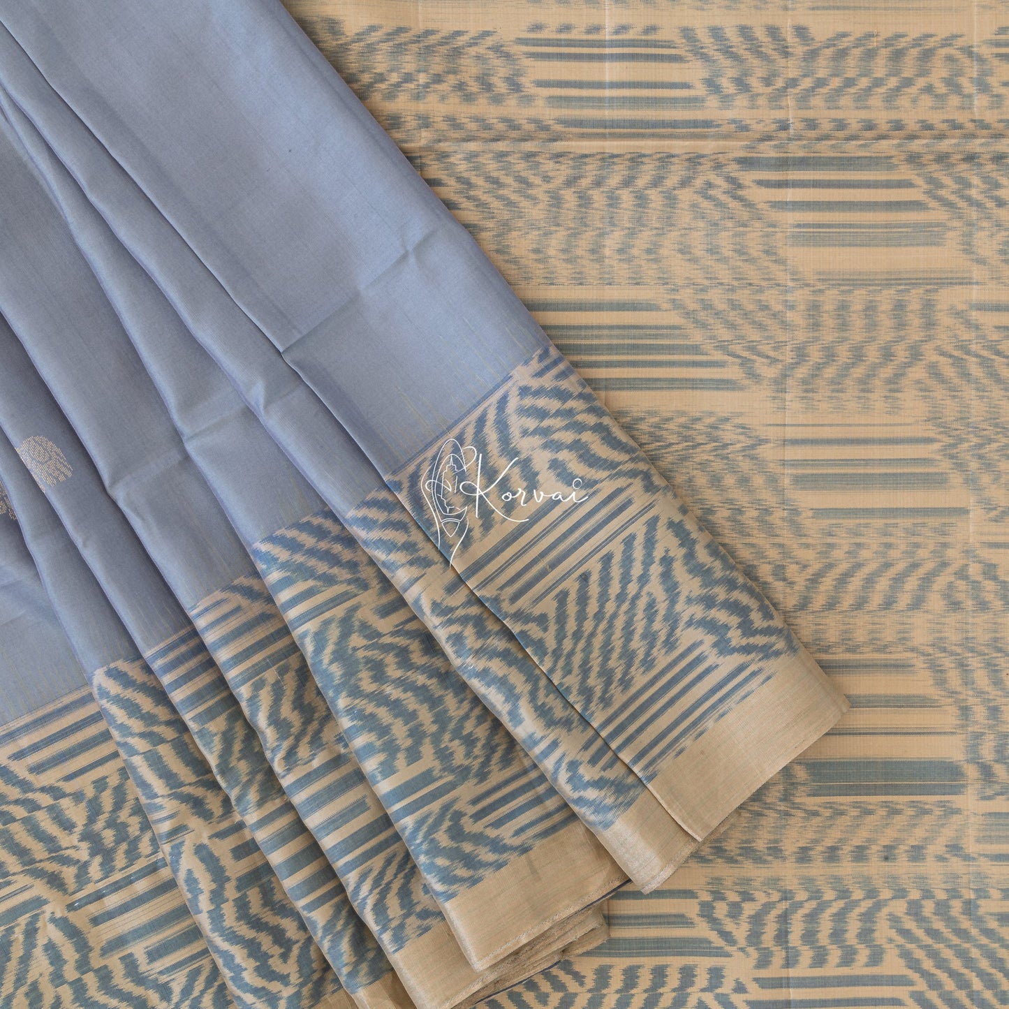 Steel grey coloured soft silk saree with tiny elephant motifs in the body.
