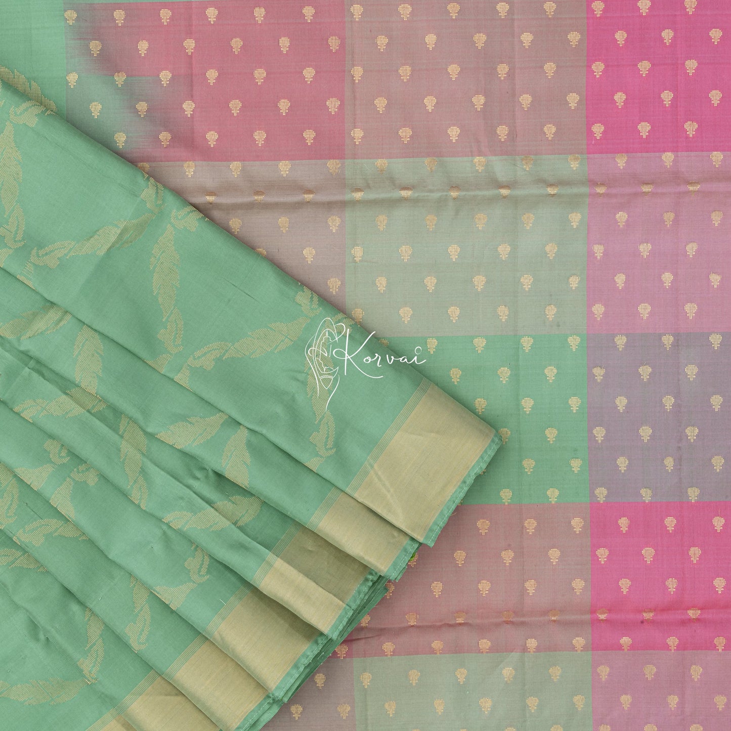 pastel green coloured soft silk saree with gold leaf vine motifs in the body.