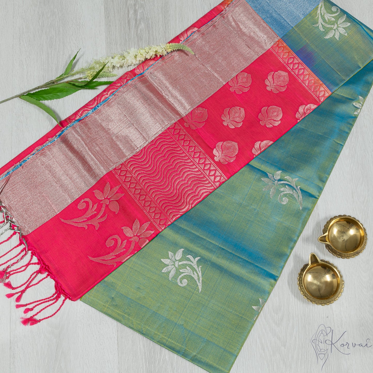 Blue green Kanjivaram soft silk saree with pink pallu.