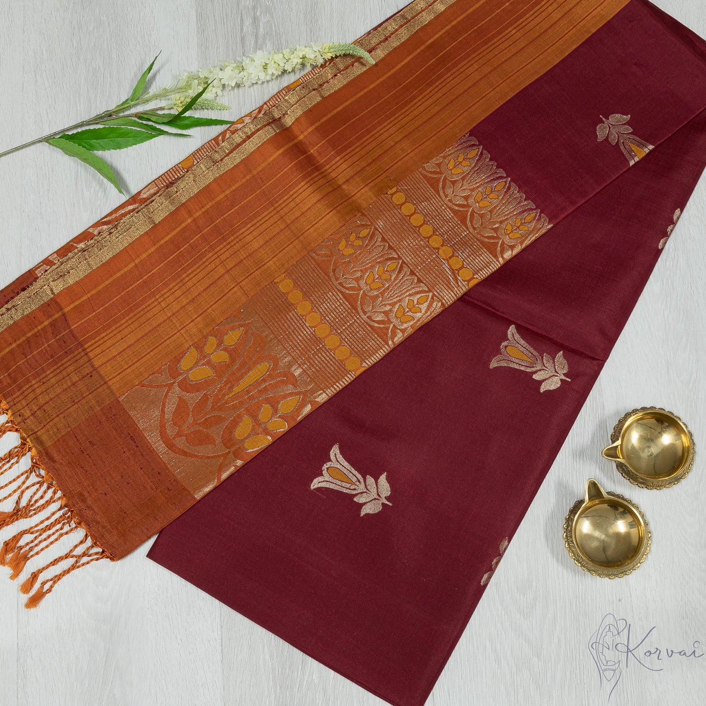 Maroon Kanjivaram soft silk saree with mustard border and pallu.