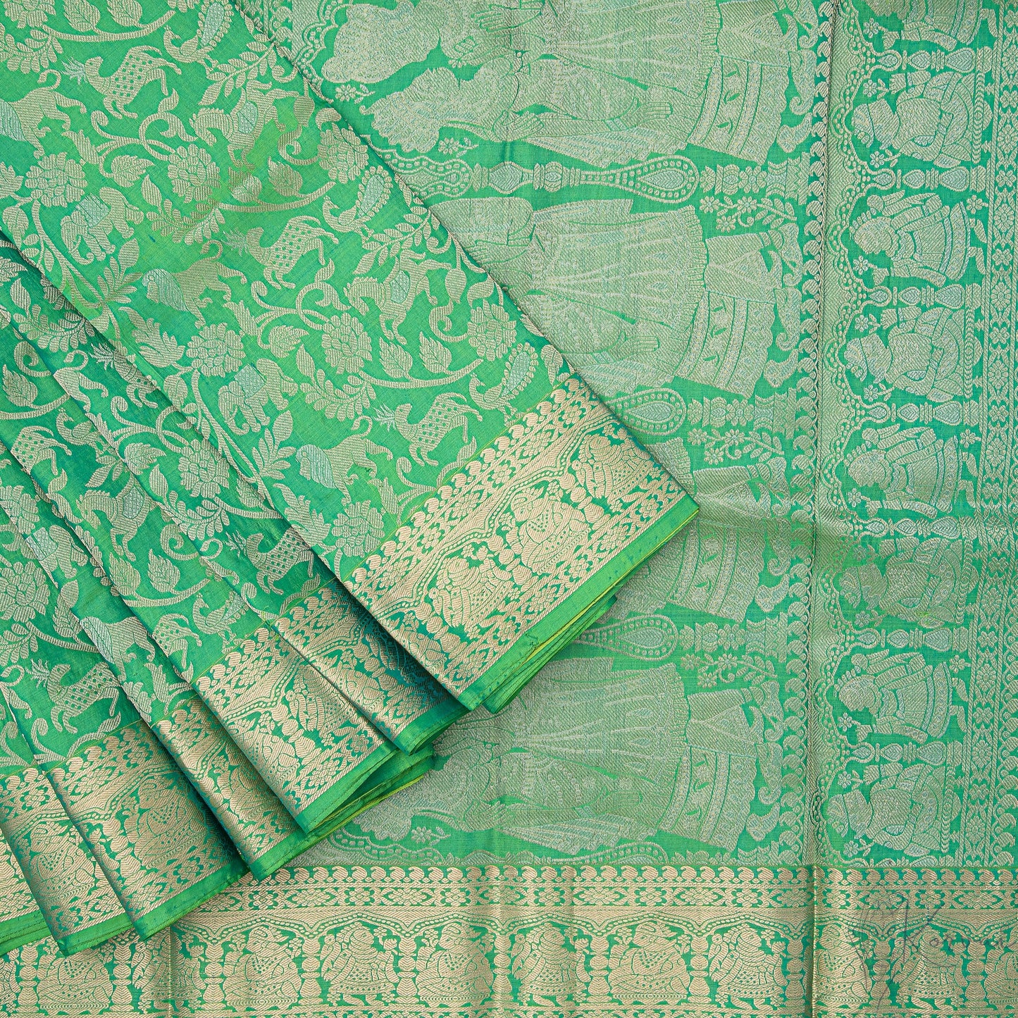 Green Kanjivaram soft silk saree with forest animals and birds motifs through the body and a closer view of Jodha Akbar style pallu.