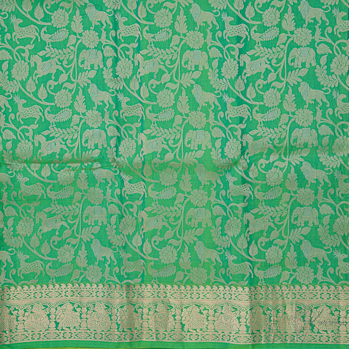 Closer view of the green body with forest animals and birds motifs.