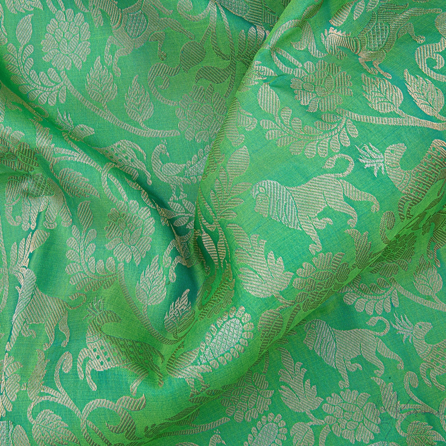 Closer view of the green body with forest animals and birds motifs.