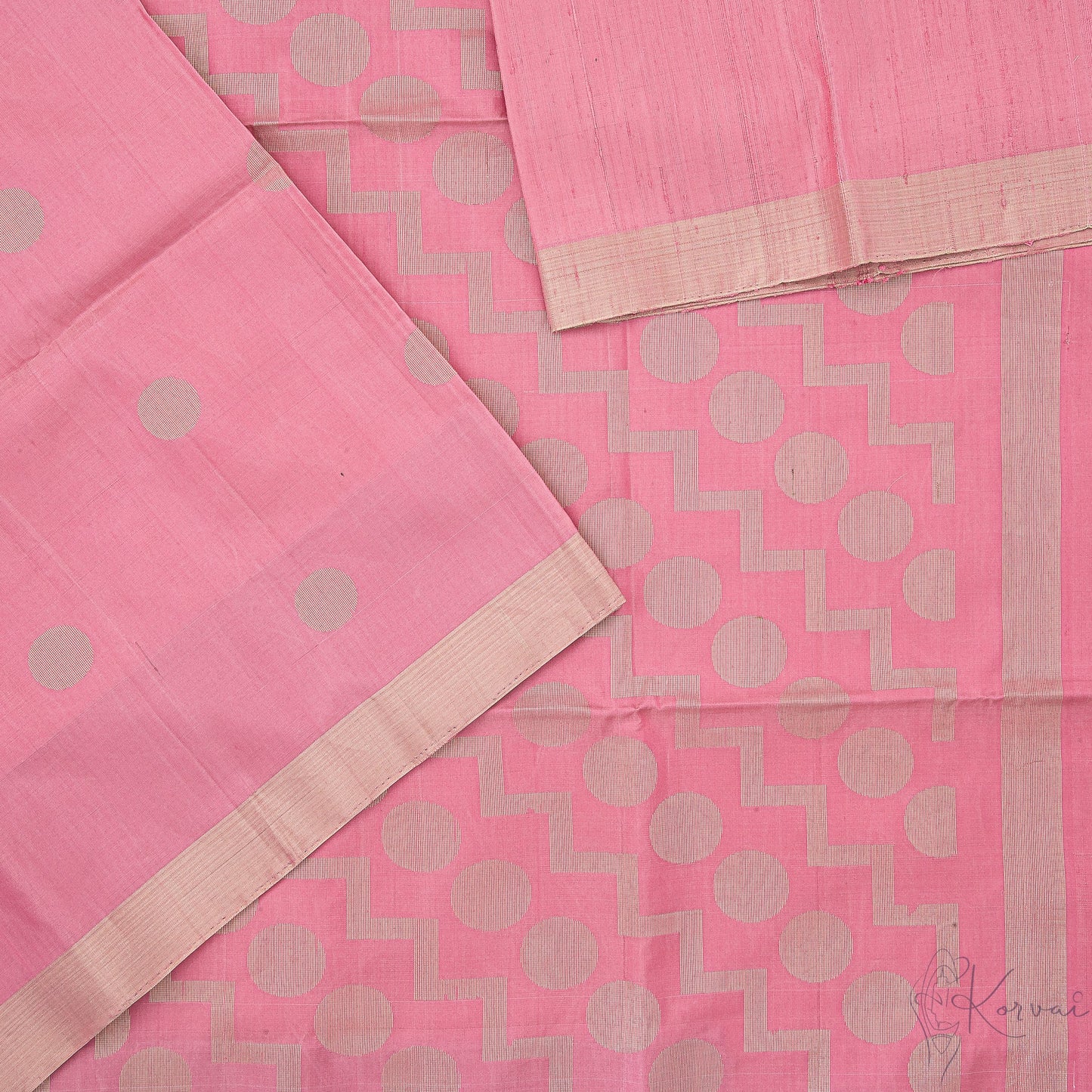 Top view of pastel pink soft silk saree with closer view of pallu that has polka dot motifs.