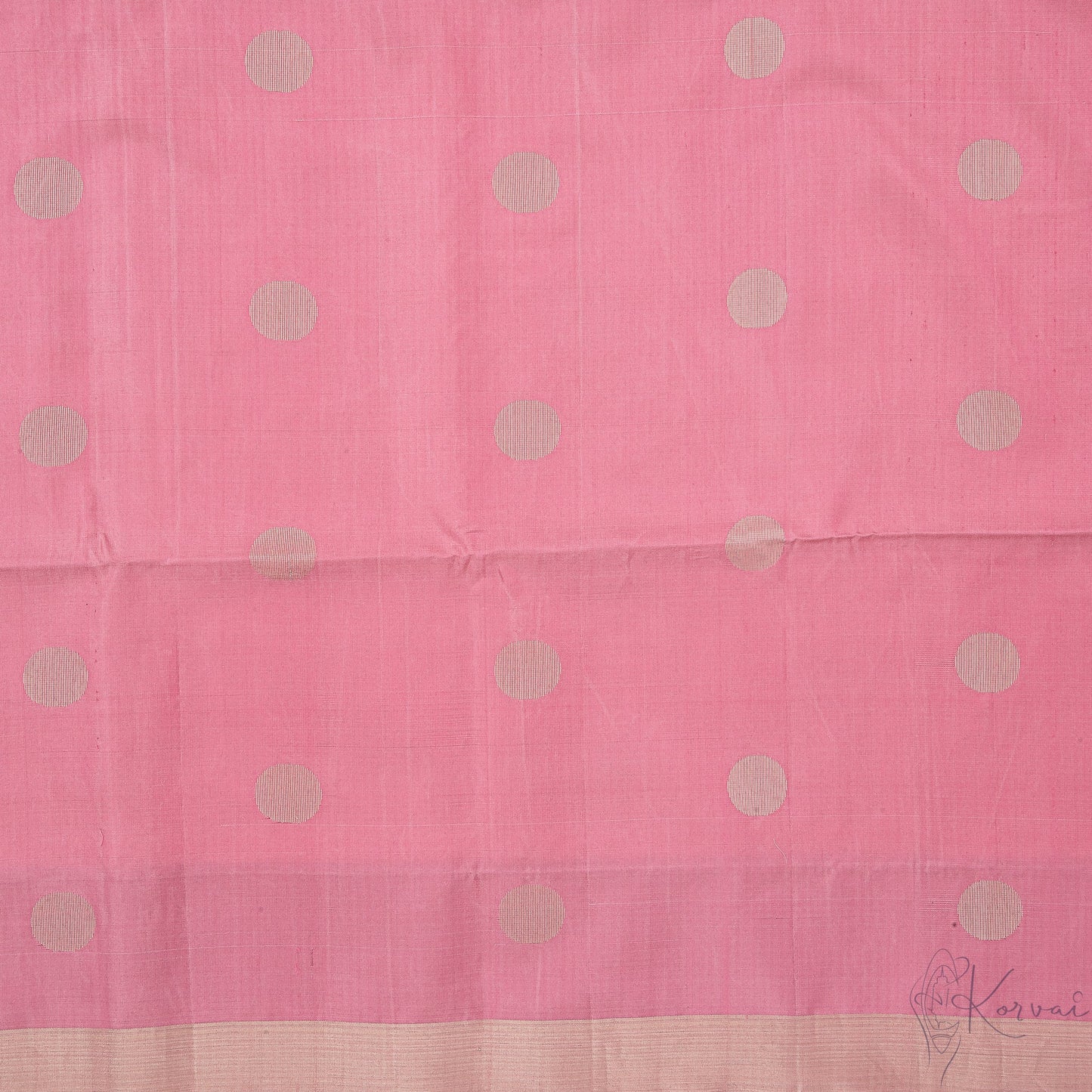 Closer view of pastel pink body with retro style polka dot motifs in gold.