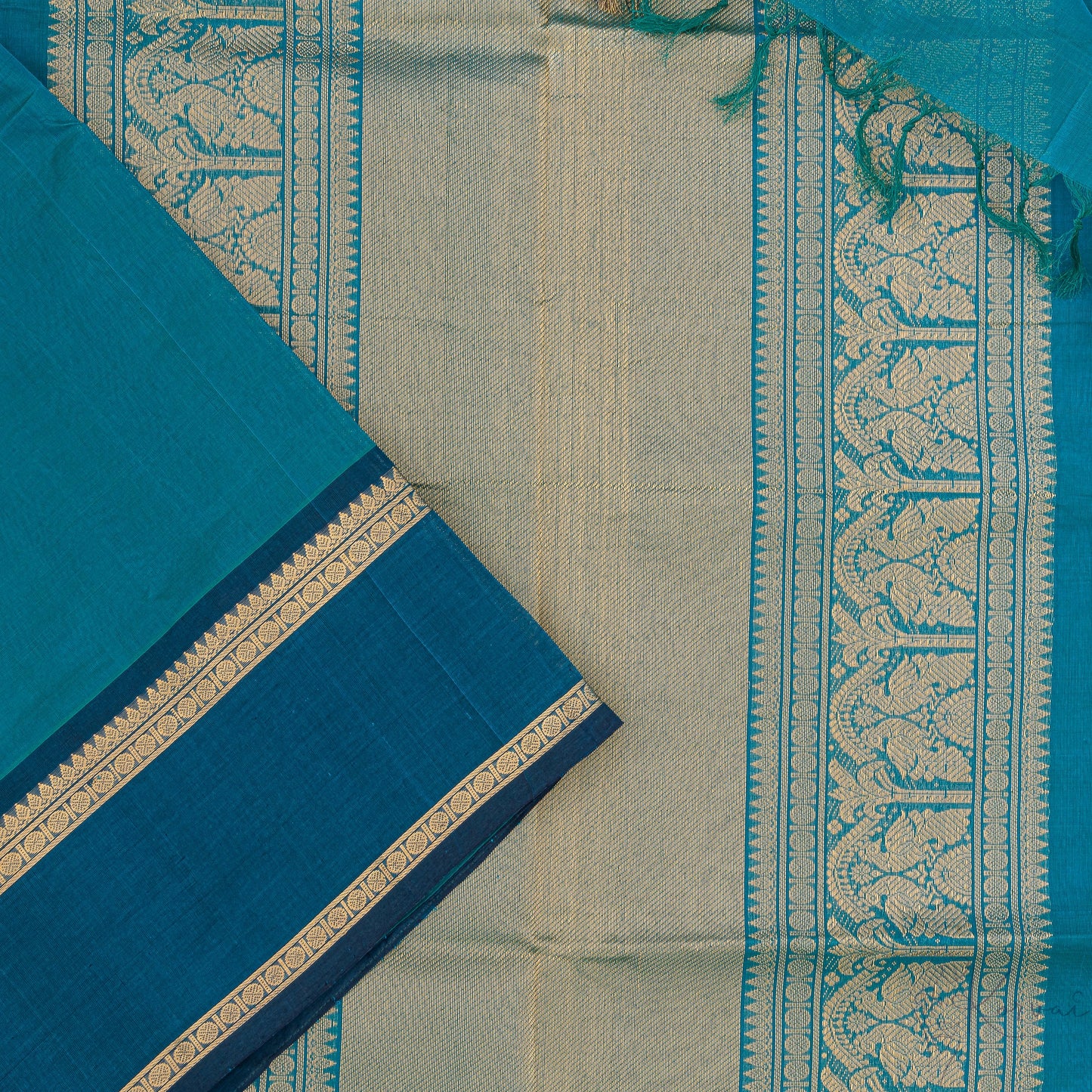 Bottle green silk cotton saree with closer view of Bottle green pallu that has intricate gold zari work.