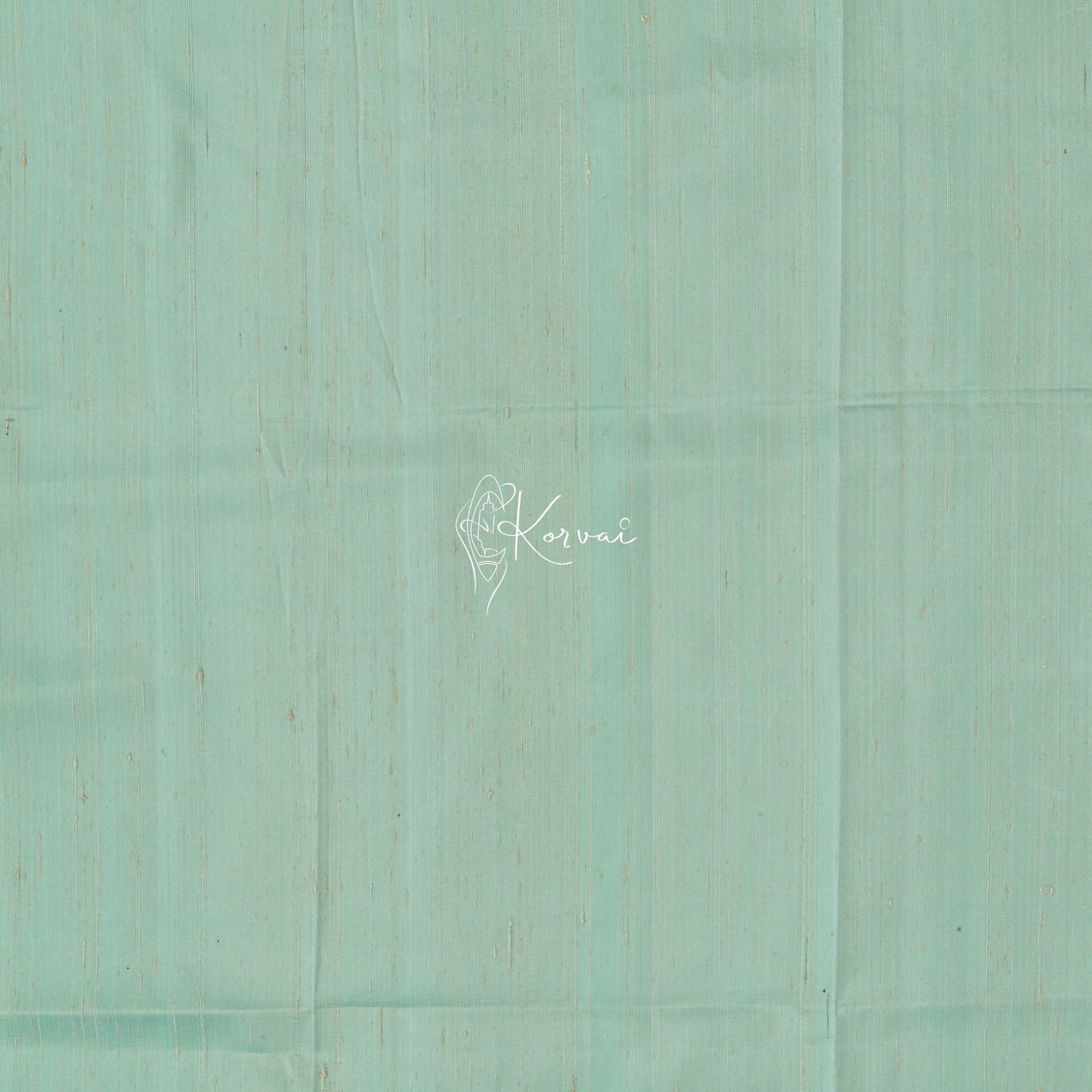Closer view of blouse fabric that is plain and same colour as the saree.