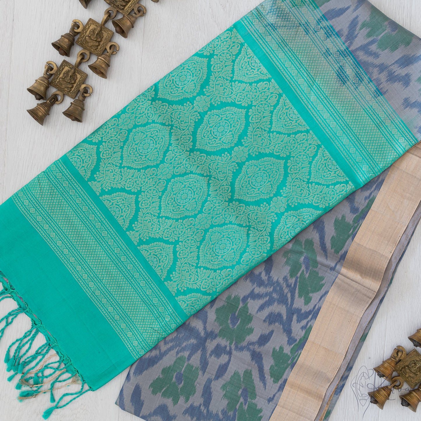 Grey Pochampallysoft silk saree with teal pallu.