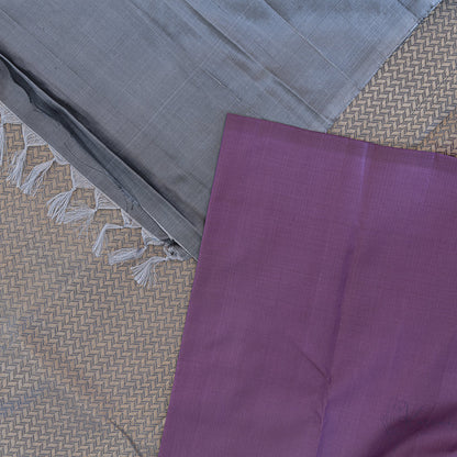 Top view of purple plain Kanjivaram saree with grey pallu and plain grey blouse fabric.