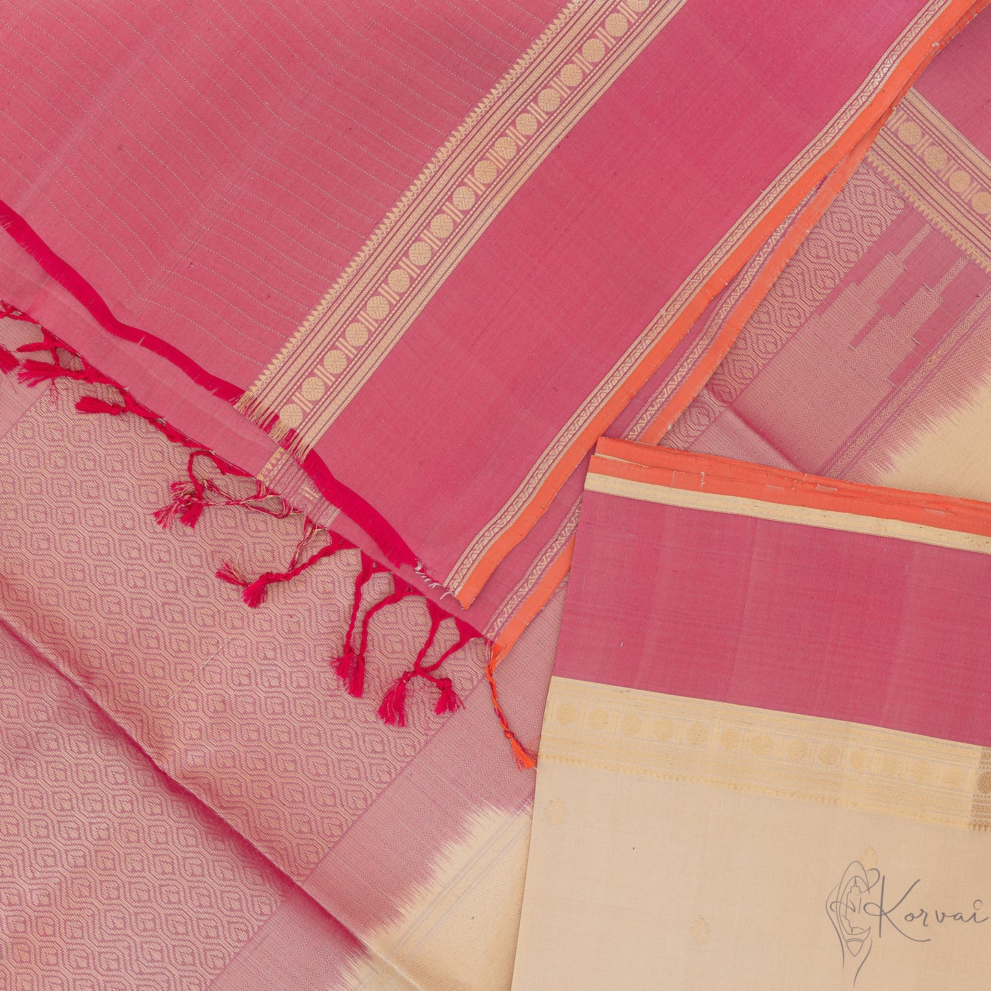 Top view of cream Kanjivaram soft silk saree with babay pink pallu and baby pink blouse fabric.