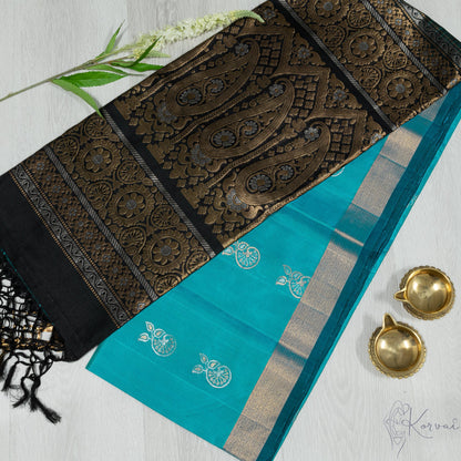 Sea blue Kanjivaram soft silk saree with black pallu that has gold zari work.