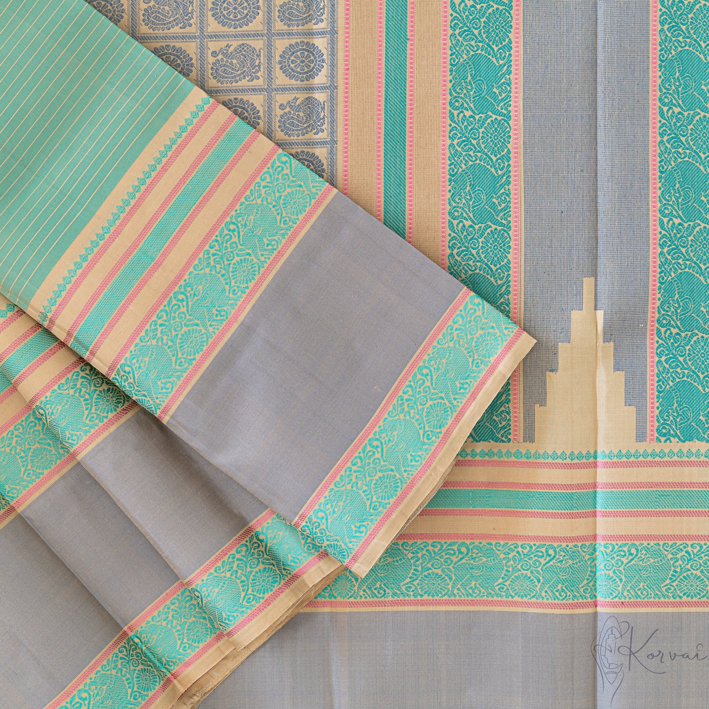 Top view of pastel green Kanjivaram soft silk saree displaying the pallu with intricate threadwork.