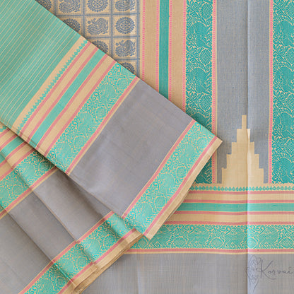 Top view of pastel green Kanjivaram soft silk saree displaying the pallu with intricate threadwork.