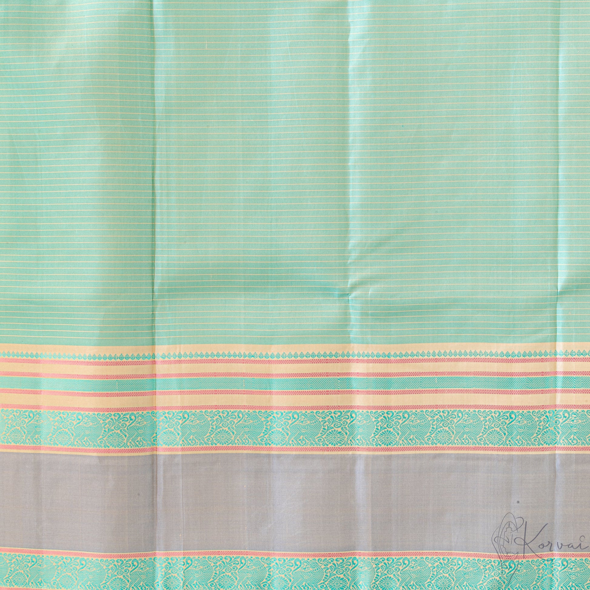 Closer view of the pastel green Kanjivaram soft silk saree with cream stripes running horizontally and grey double border.