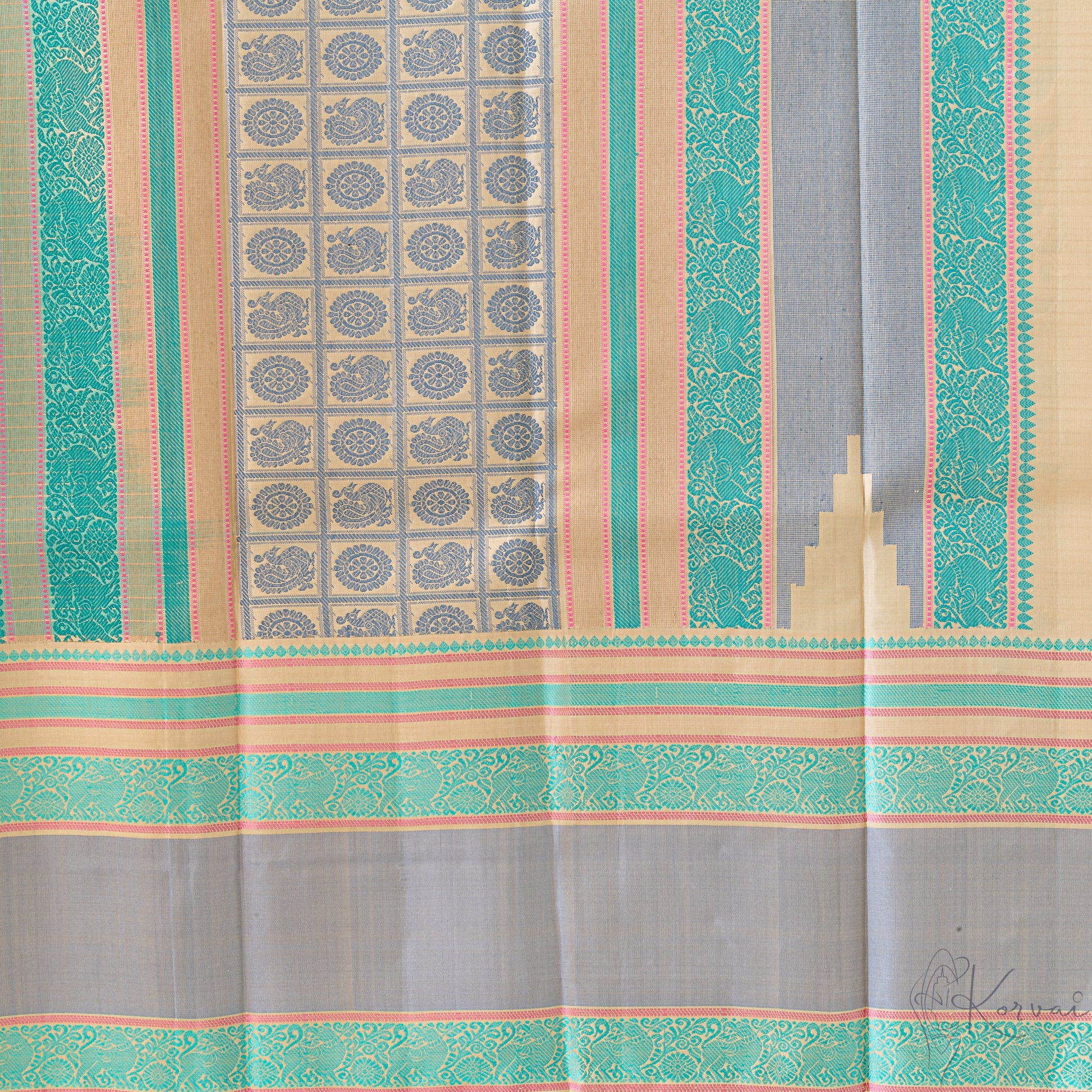 Closer view of pallu with peacock and wheel motifs in grey thread and grey double border.