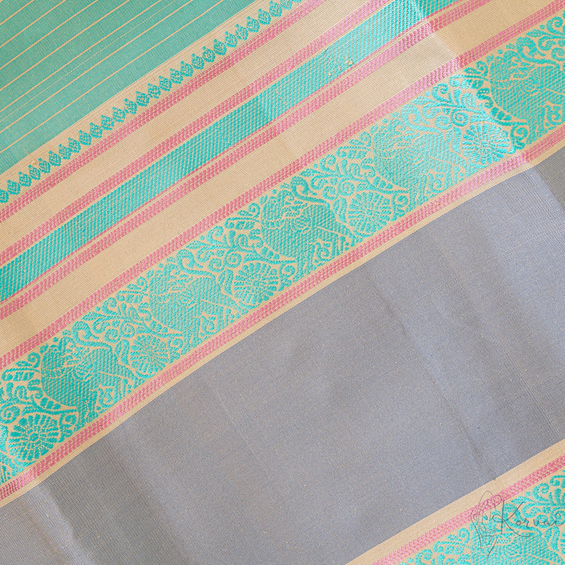 Closer view of the border showing pastel green yali motifs.