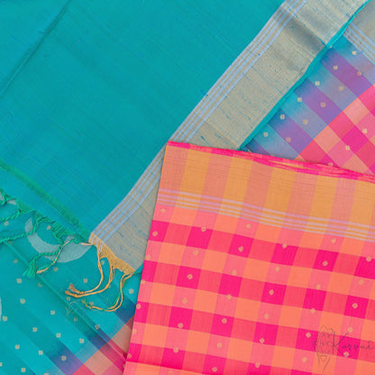 Top view of pink and cream checkered Kanjivaram soft silk saree with teal pallu.