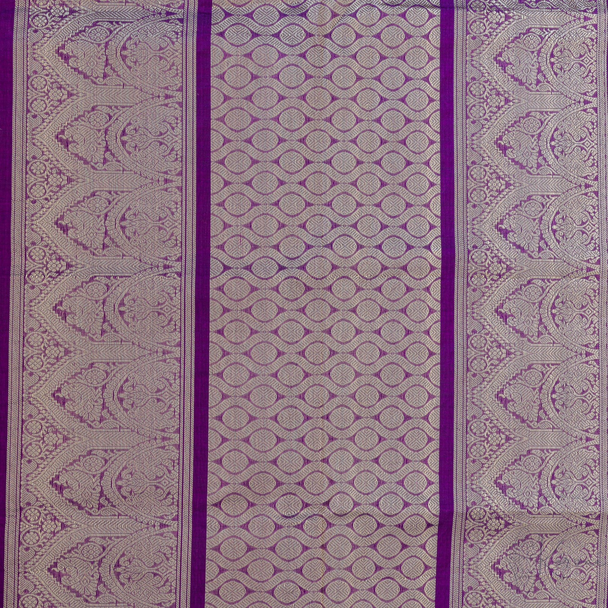 Closer view of violet pallu with intricate gold zari work.