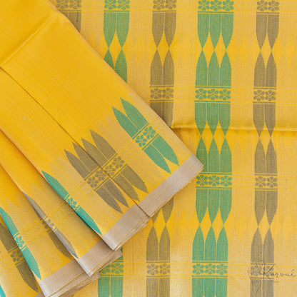 Top view of the yellow Kanjivaram soft silk saree displaying the beauty of pallu with the contemporary design.