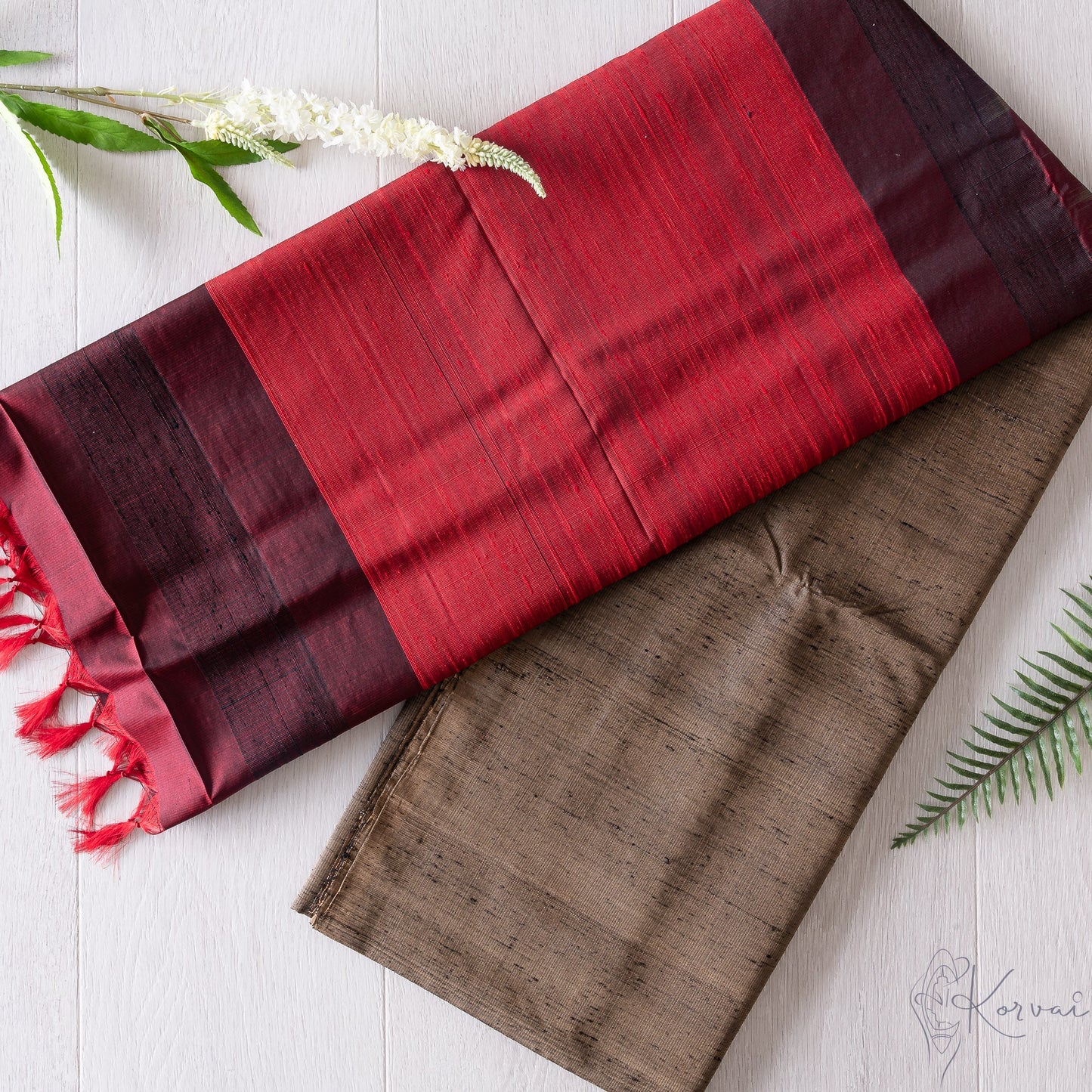 Gold and black shot coloured plain Kanjivaram soft silk saree with wine red pallu.