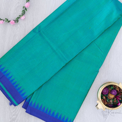 Teal and blue korvai Kanjivaram silk saree with blue temple motifs at the border.