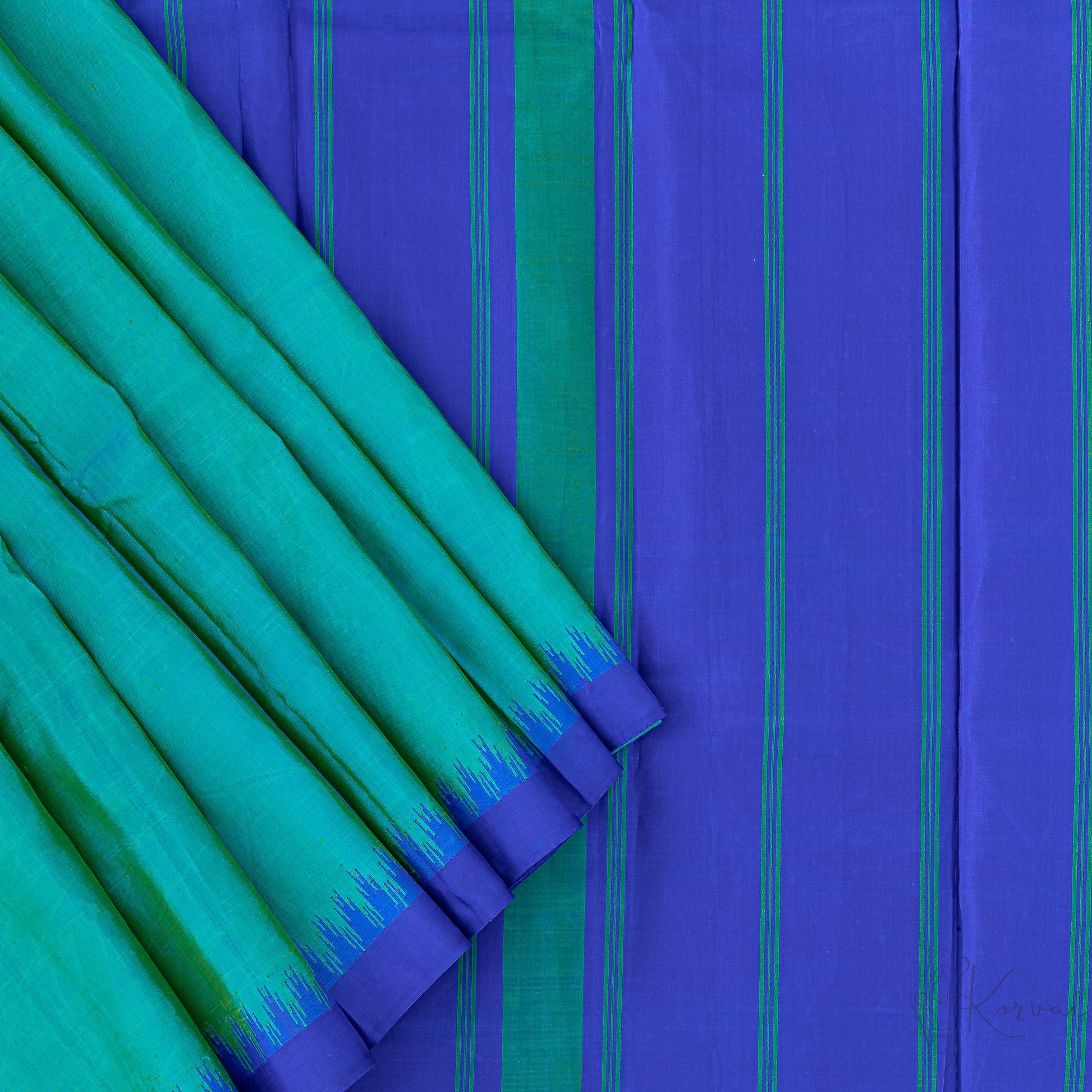 Top view of teal Kanjivaram saree with closer view of blue pallu.