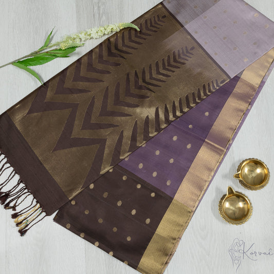 Purple and lilac boxed Kanjivaram soft silk saree with broen pallu and intricate gold zari works.