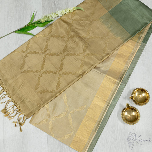 Shades of green boxed Kanjivaram soft silk saree with cream pallu and gold zari work.