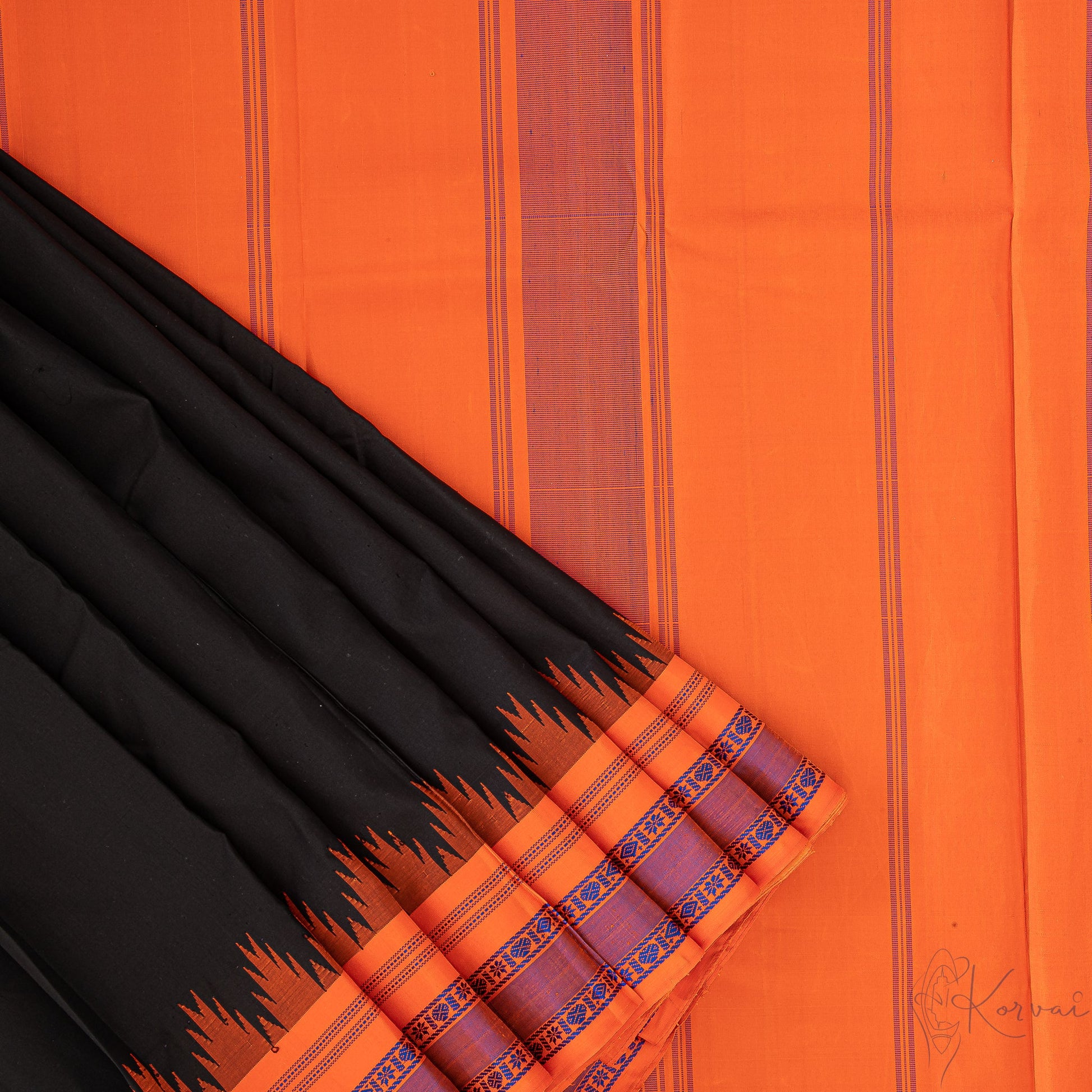 Plain black Kanjivaram saree with a closer view of orange pallu.