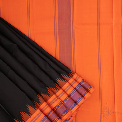 Plain black Kanjivaram saree with a closer view of orange pallu.