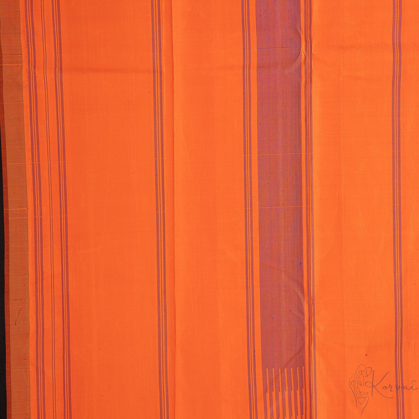 Closer view of orange pallu with blue stripes.