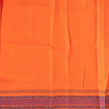 Closer view of orange blouse fabric.