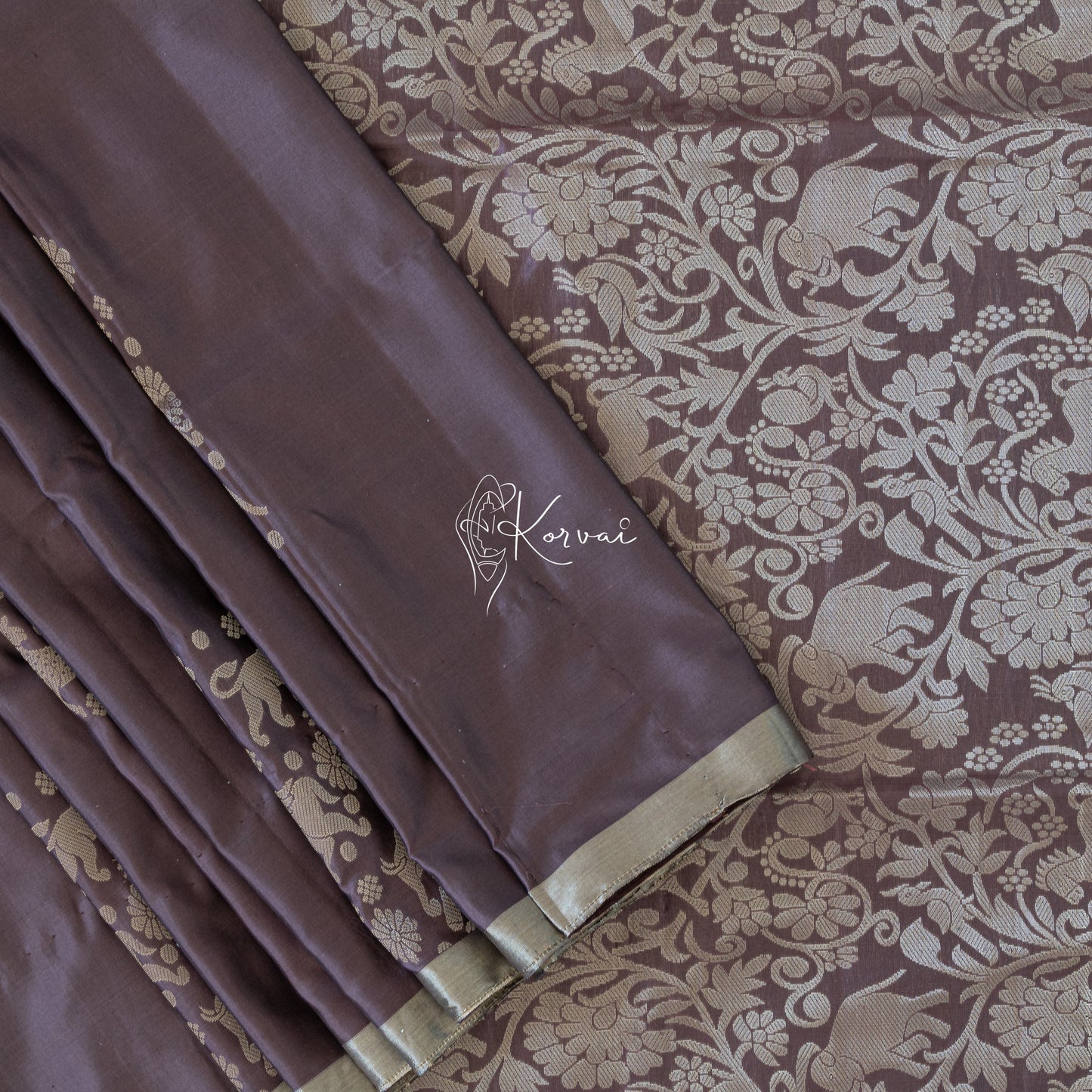 Hickory coloured soft silk saree with vanasingaram motifs in the body and on the pallu.