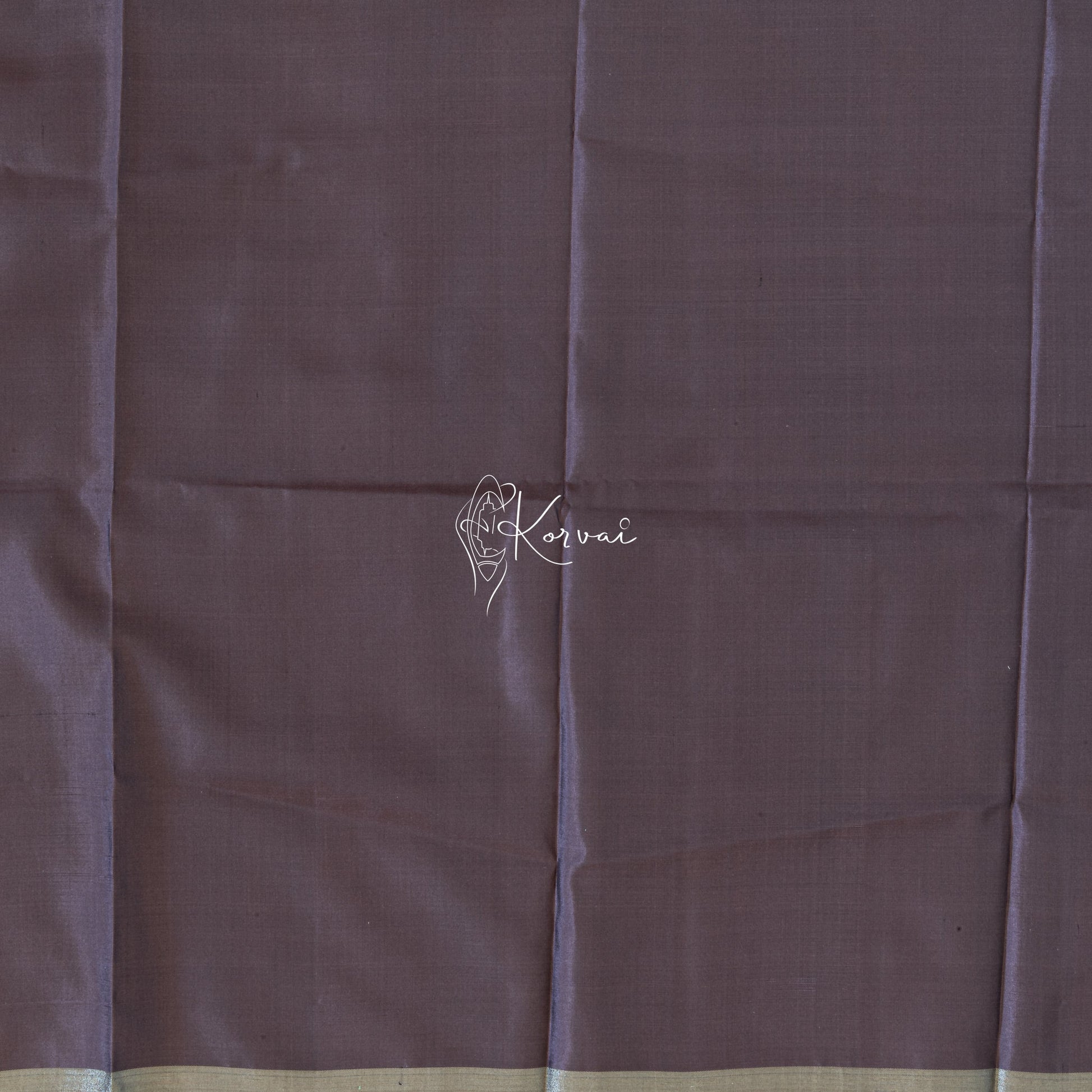 Closer view of blouse fabric that is plain and same colour as the saree.