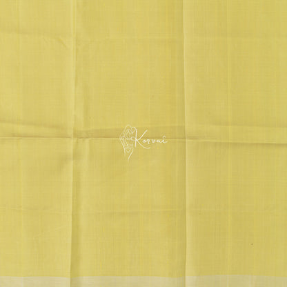 Closer view of blouse fabric that is plain and same colour as the saree.