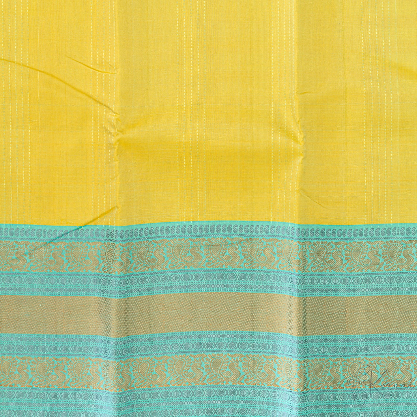 Closer view of the lemon green Kanjivaram soft silk saree with teal stripes running vertically and tealdouble border.