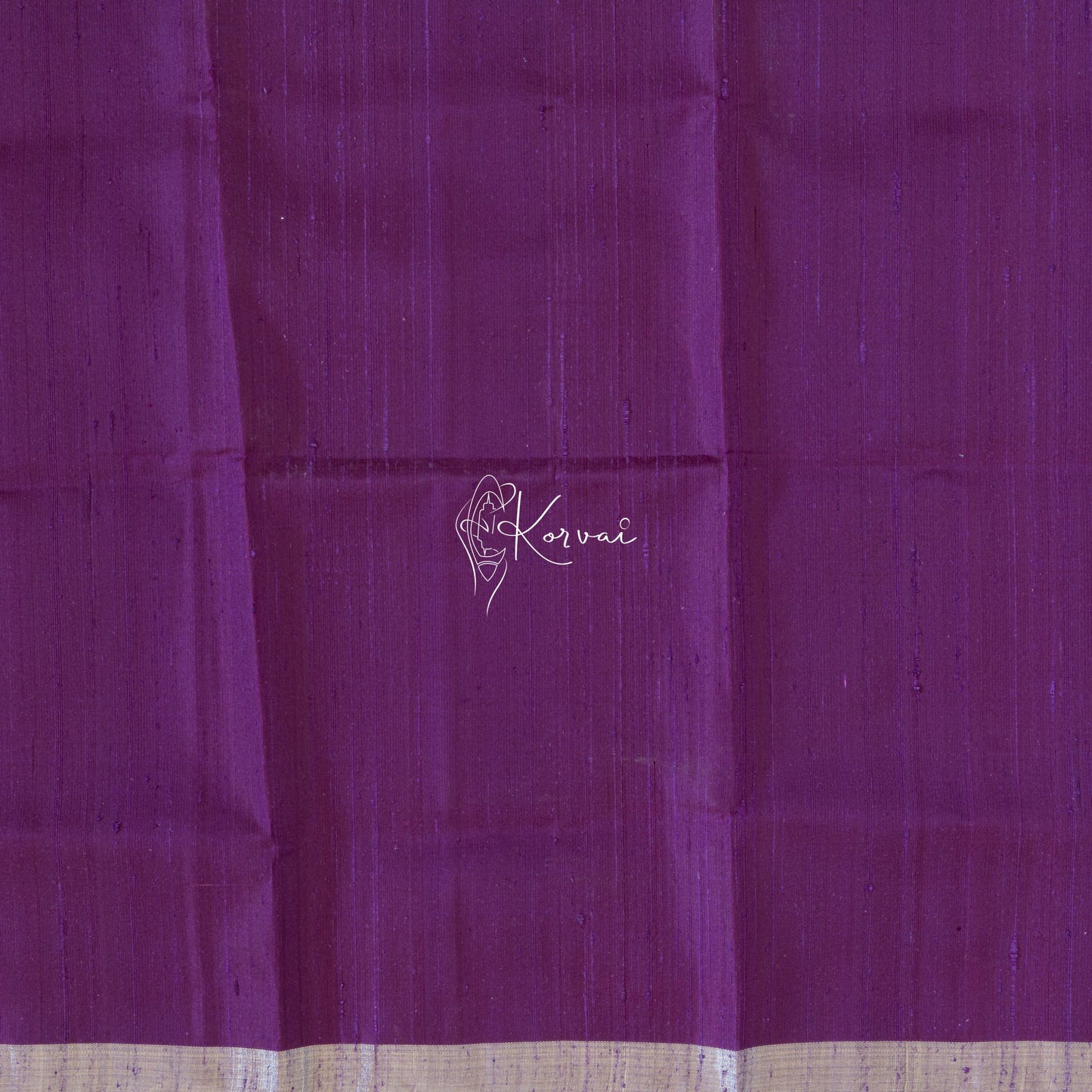 Closer view of blouse fabric that is plain and same colour as the saree.