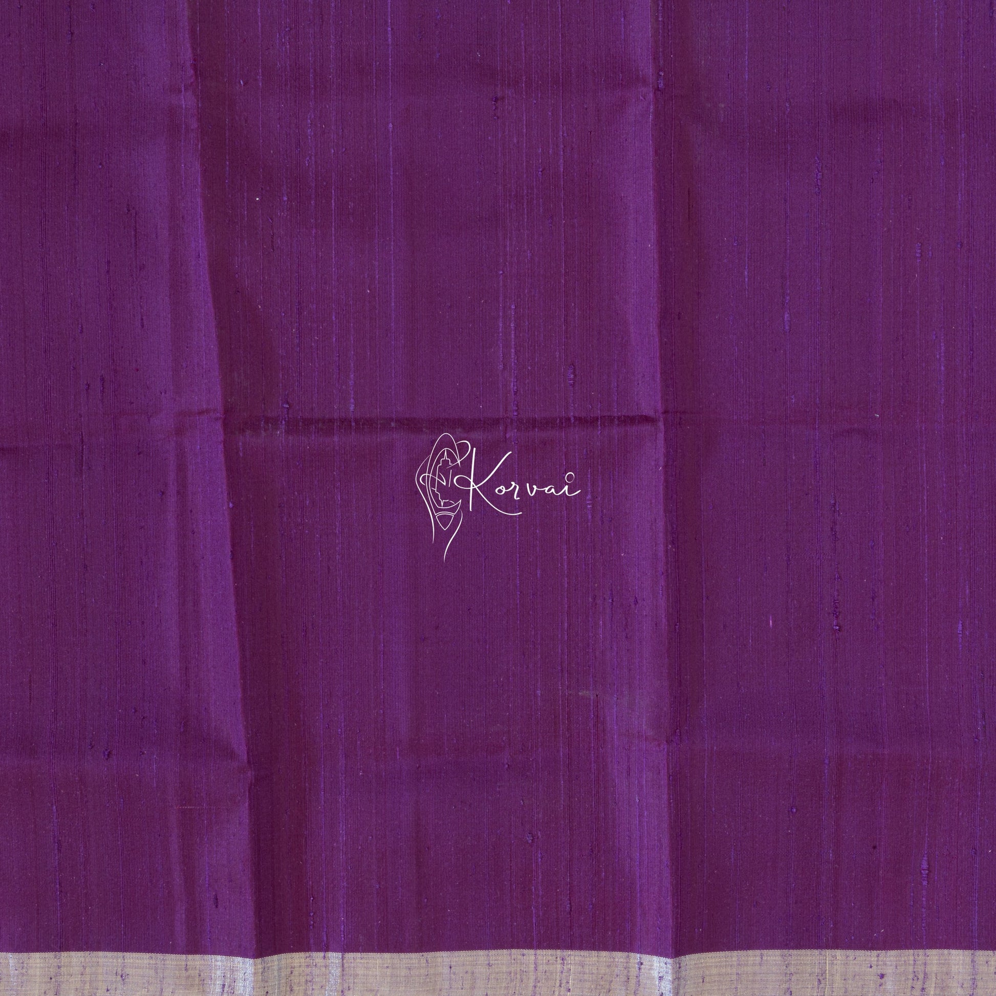 Closer view of blouse fabric that is plain and same colour as the saree.