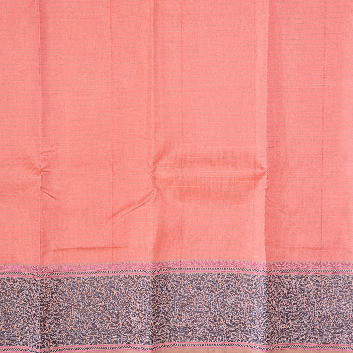 Closer view of the peach coloured body of the saree with cream stripes running horizontally and grey paisley motifs in the border.