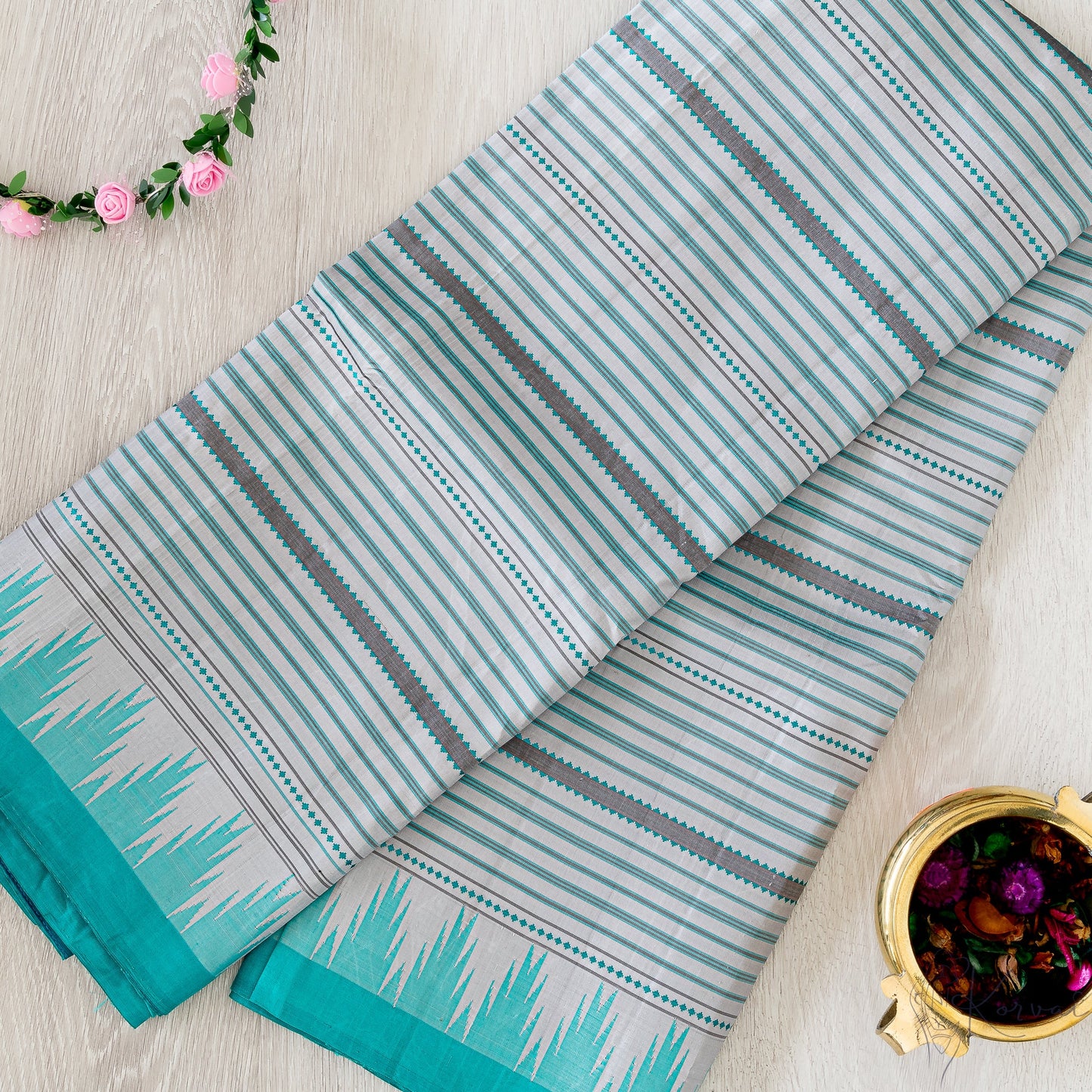 Grey Kanjivaram silk saree with dark grey veldhari stripes and teal korvai temple border.