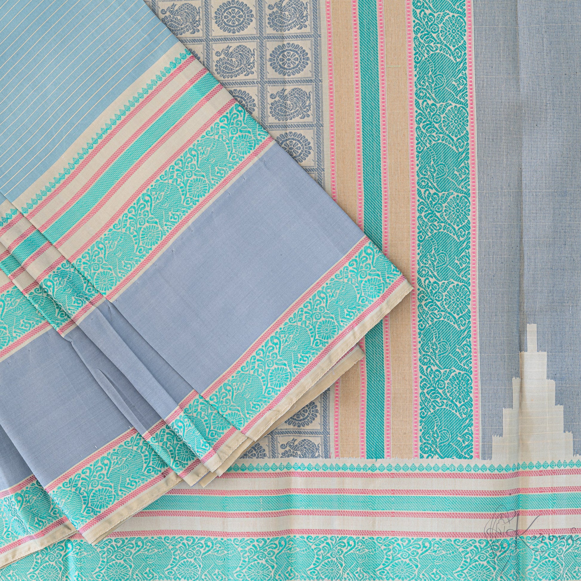 Steel grey Kanjivaram soft silk saree with teal double border and teal pallu.