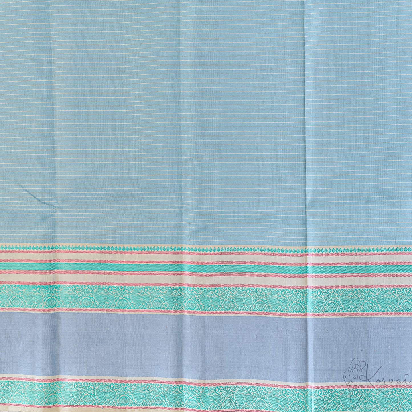 Closer view of the steel grey Kanjivaram soft silk saree with cream stripes running horizontally and teal double border.